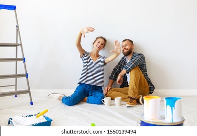 young happy family married couple dreams of renovating  house and planning a design project