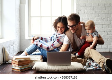 Young happy family relaxing at home 