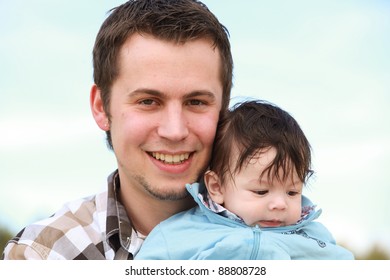 A Young Happy Father 25 Years With His 4  Month Old Son.