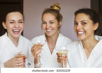 Young Happy Female Friends Drinking Champagne In Spa And Have Fun