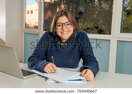 Similar – Image, Stock Photo Smiling businesswoman working at desk with laptop