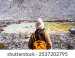 Young happy female traveler enjoying at Huanglong National Park in Sichuan, China