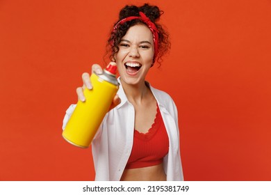 Young Happy Fun Cool Woman Of African American Ethnicity Wear White Shirt Top Hold Paint Spray Bottle Make Graffiti Stretch Hand To Camera Isolated On Plain Orange Background People Lifestyle Concept