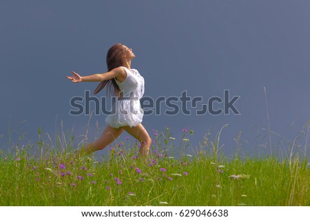 Similar – Image, Stock Photo girl walking in a field with yellow flowers sunny day