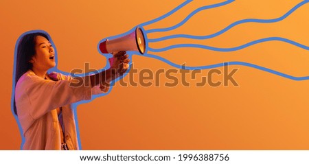 Young happy girl screaming in loudspeaker isolated over bright yellow blue background in neon light. Concept of beauty, fashion. Flyer. Copy space dor text, ad.
