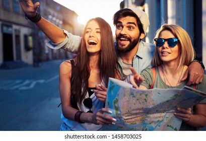 Young Happy Group Of Friends Sightseeing In City