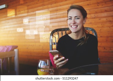 Young happy hipster girl with mobile phone in hands looking to the camera.Cheerful female student using cell telephone. Infographics design elements of popular social network application and programs - Powered by Shutterstock