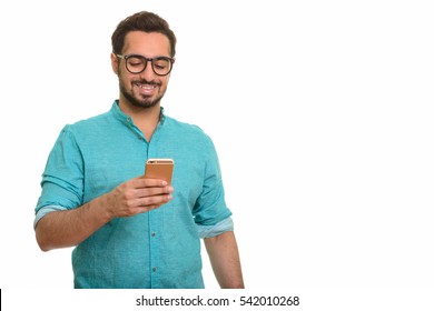 Young Happy Indian Man Using Mobile Phone Isolated Against White Background