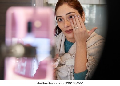 Young Happy Influencer Woman In The Middle Of A Video Call With Her Phone, Showing Her Wedding Ring