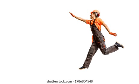 Young happy laughing caucasian man builder construction worker in a safety helmet is jumping on white background isolated. Copy space for your text and logo. Industry concept - Shutterstock ID 1986804548