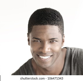 Young Happy Man With Big Natural Smile Against White Background