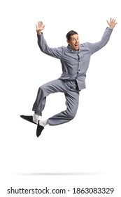 Young Happy Man In Pajamas Jumping Isolated On White Background