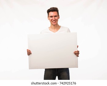 Young Man Holding Sign Studio Stock Photo (Edit Now) 1936424116