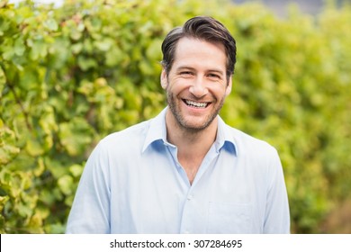 Young Happy Man Smiling At Camera In The Grape Fields