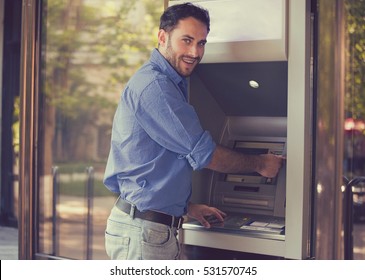 Young Happy Man Using ATM