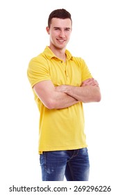 Young Happy Man In A Yellow Polo Shirt With Crossed Arms