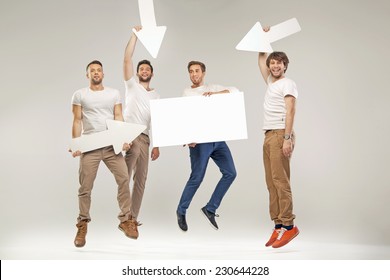 Young happy men with empty board  - Powered by Shutterstock