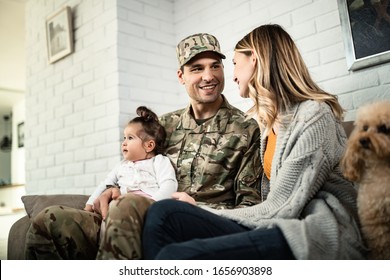 Young happy military man relaxing with his family at home.  - Powered by Shutterstock