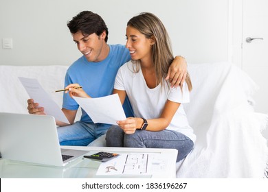 Young Happy People Looking At Laptop, Building Family Financial Plan, Meal Planning For Healthy Style, Wedding Ideas, Ordering Gifts, Free Online Courses To Get Diploma. Man Working In Home Office