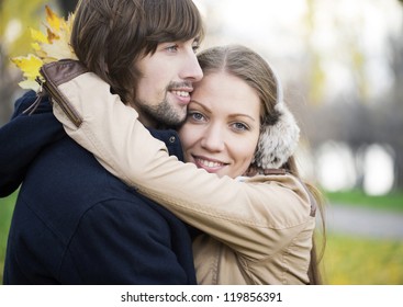 Young happy smiling attractive couple together outdoors