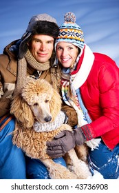 Young  Happy Smiling Couple With Dog. Winter