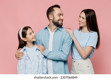 Young Happy Smiling Fun Cool Parents Mom Dad With Child Kid Daughter Teen Girl In Blue Clothes Look To Each Other Isolated On Plain Pastel Light Pink Background Family Day Parenthood Childhood Concept