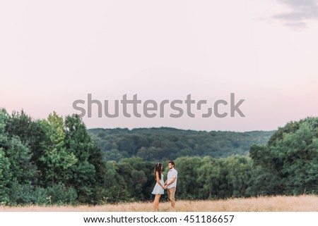 Similar – Women friends laughing while walking in forest