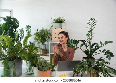 Young Happy Successful Woman Florist In Her Flowershop Surrounded With Flowers In Flowerpots Working Job She Love As Small Business Owner.