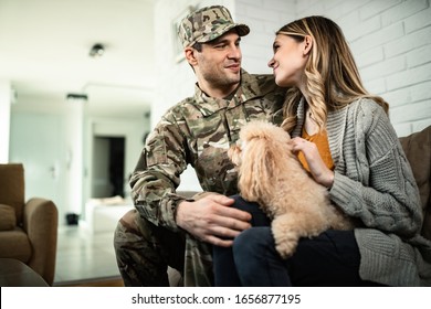 Young Happy Veteran Talking To His Wife While Coming Home From Military Assignment.