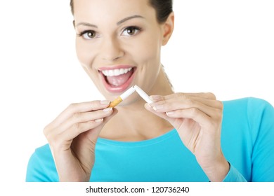 Young Happy Woman With Broken Cigarette. Stop Smoking Concept.