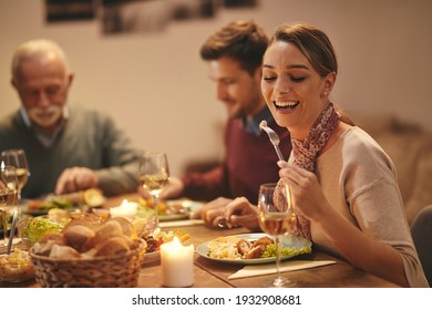 Young Happy Woman Enjoying In Family Dinner In Dining Room At Home.