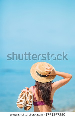 Similar – Woman applying sunscreen by the pool during summer