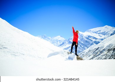 Young Happy Woman Hiker Successful On Mountain Peak Summit In Winter Mountains. Climbing Inspiration And Motivation Beautiful Landscape. Fitness Healthy Lifestyle Outdoors On Snow In Himalayas, Nepal.