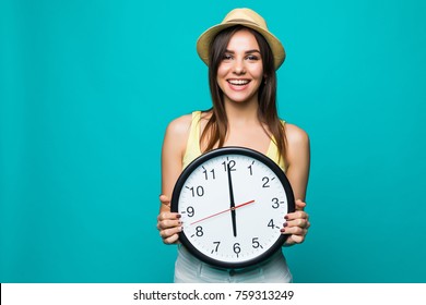 Young Happy Woman Holding A Clock With 12 Clock On A Green