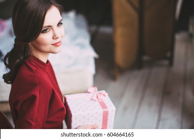 Young Happy Woman Holding A Stylish Gift. Celebration.