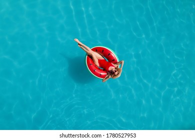 Young Happy Woman With Inflatable Ring In Swimming Pool, Top View. Summer Vacation