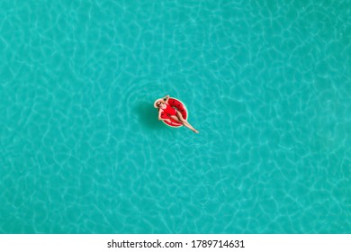 Young Happy Woman With Inflatable Ring In Swimming Pool, Top View. Summer Vacation