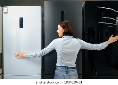 Young Happy Woman Leaning On Her New Refrigerator In A Mall