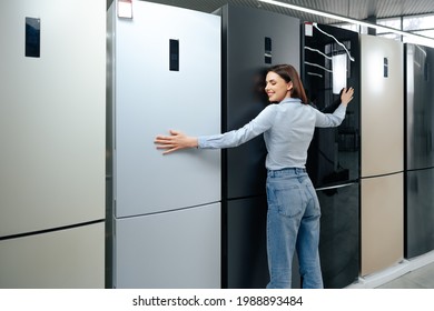 Young Happy Woman Leaning On Her New Refrigerator In A Mall