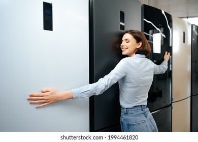 Young Happy Woman Leaning On Her New Refrigerator In A Mall