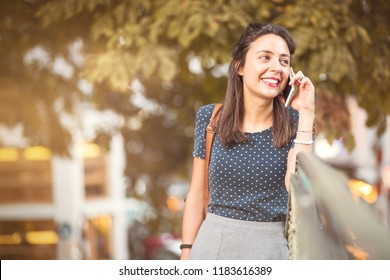 Young, Happy Woman Listening To A Cell Phone Call