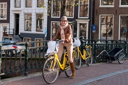 Young Happy Woman On Bicycle In European City, Amsterdam, Netherlands