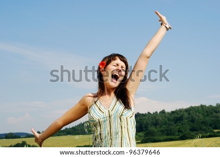 young happy woman outdoors in summer