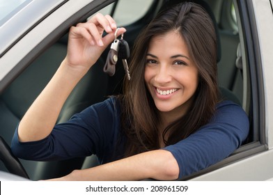 Young Happy Woman Showing The Key Of New Car