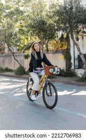 Young Happy Woman In Trendy Outfit Riding Bicycle On Sunny Street In Turkey