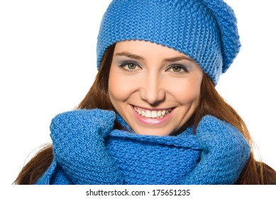 Young happy woman wearing winter cloth, isolated over white
