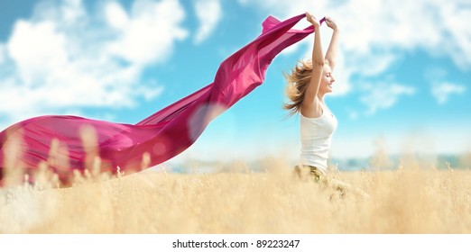 Young Happy Woman In Wheat Field With Fabric. Summer Picnic