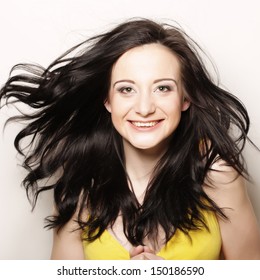 Young Happy Woman With Wind In Hair