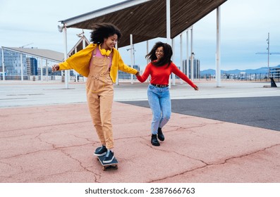 young happy women having fun outdoor , laughing and sharing good mood. Teenagers girls walking at the harbor in Barcelona after school - Powered by Shutterstock