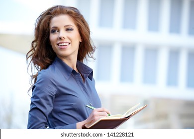 Young Happy Women Or Student On The Property Bussines Background